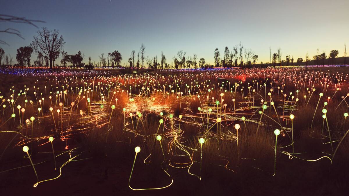 Bruce Munro's Field of Light illuminates the red dirt.