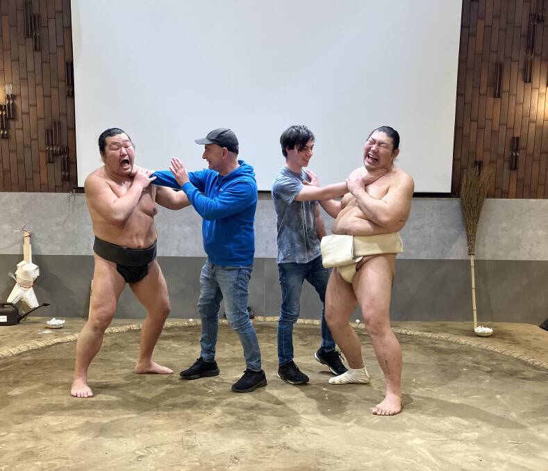 A writer and his son overpower the sumo wrestlers.
