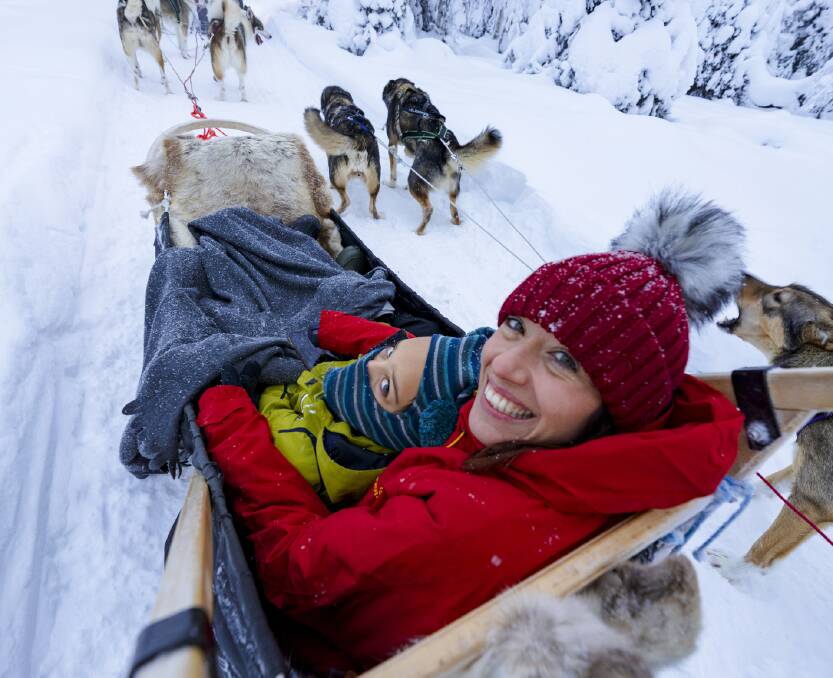 All smiles on a sled ride in Lapland, Finland. Picture: Getty Images All smiles on a sled ride in Lapland, Finland. Picture: Getty Images