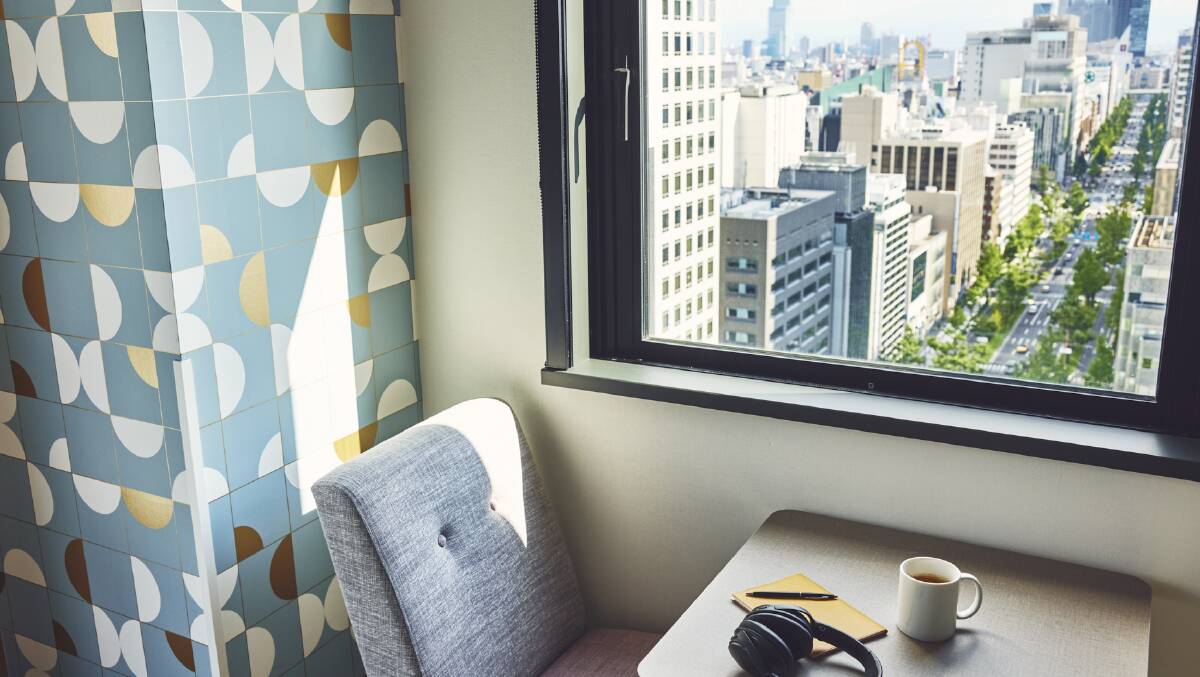A guestroom with city views. A guestroom with city views.