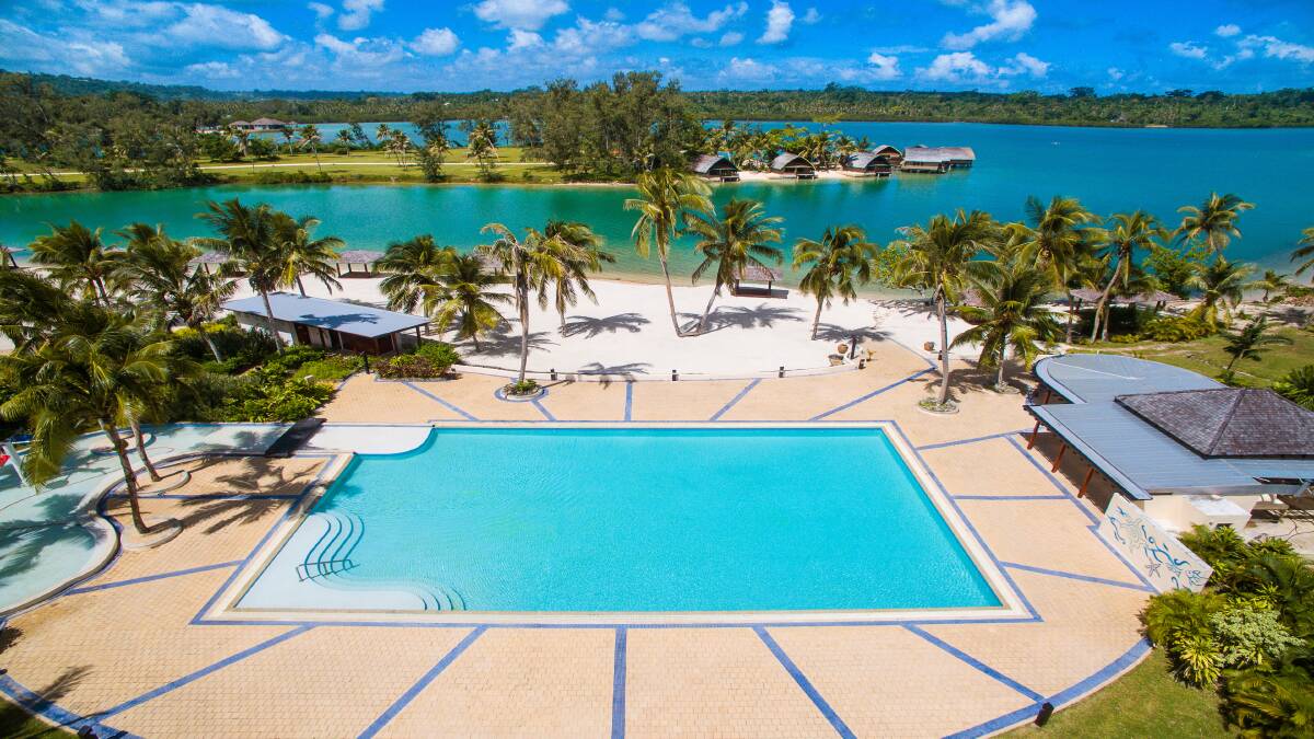 The swimming pool with sea views.