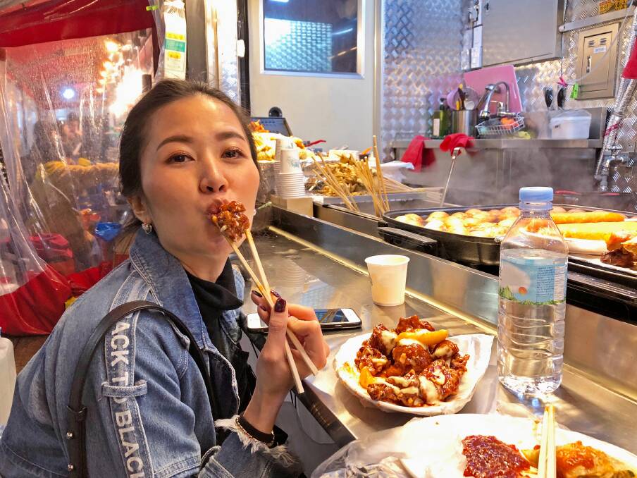 A Seoul local tuckes into KFC. A Seoul local tuckes into KFC.