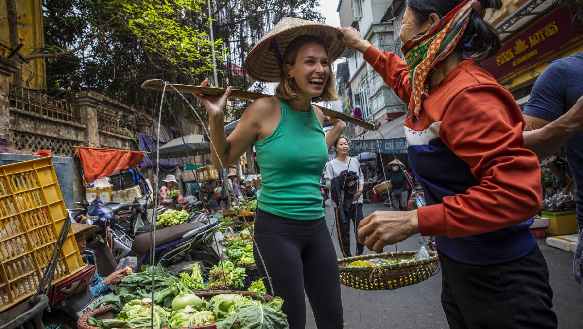 Interacting with locals in Hanoi.