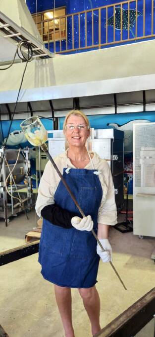 The writer at her glass-blowing workshop.