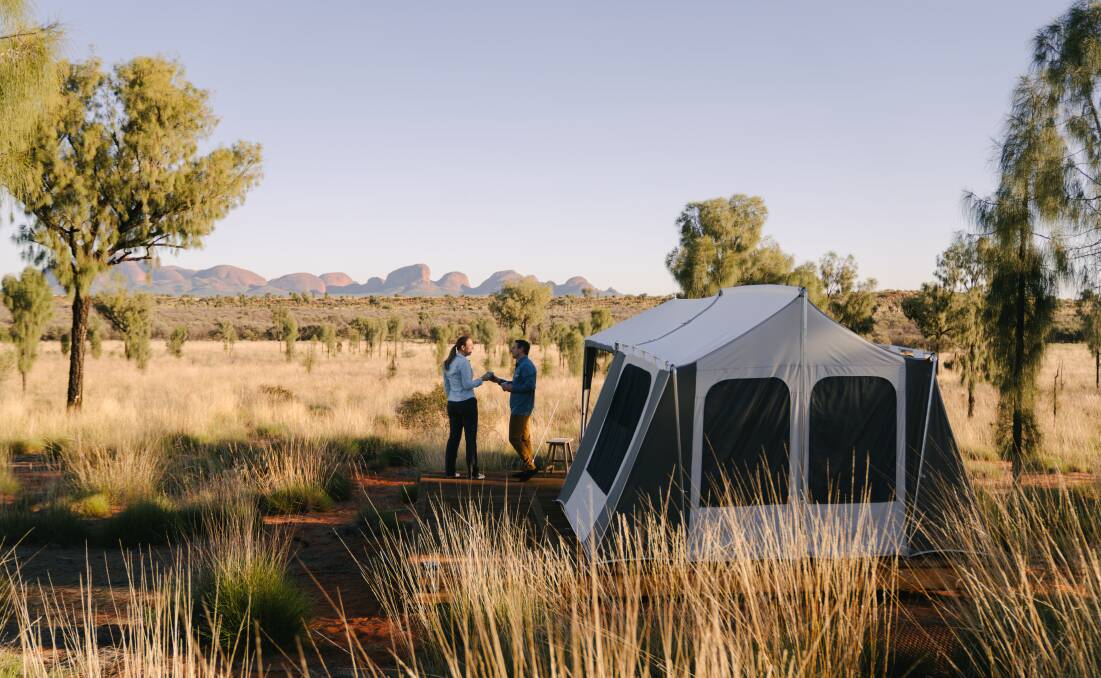 Pitching a tent in the Red Centre. Picture by Michael Peters Pitching a tent in the Red Centre. Picture by Michael Peters