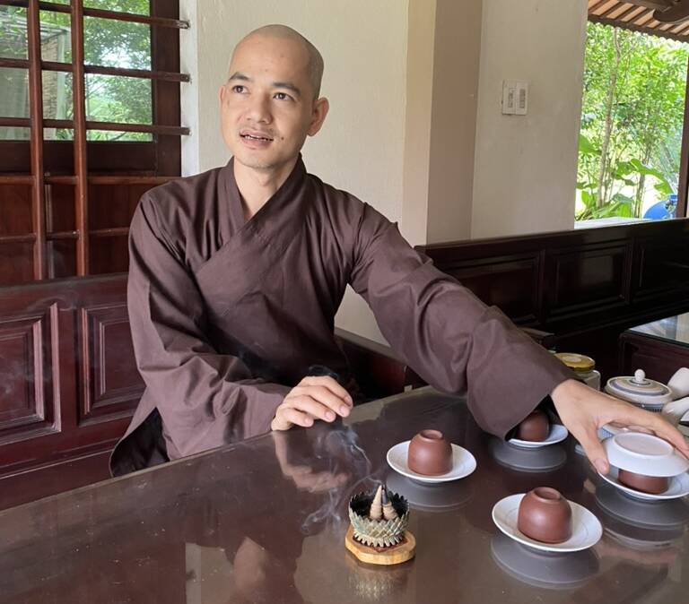 Have tea with with a Buddhist monk at Azerai La Residence.