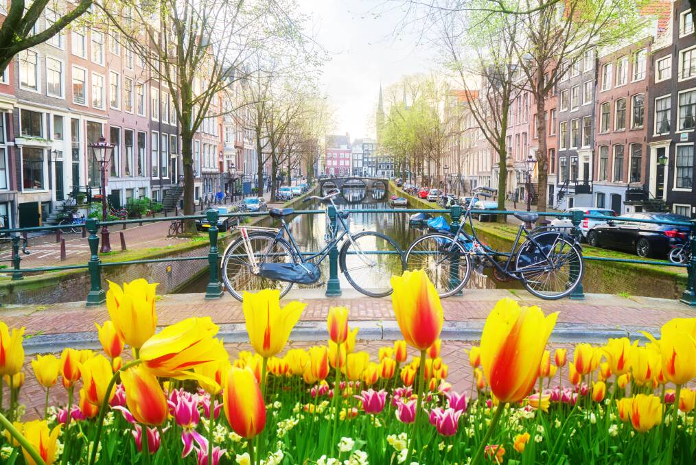 Tulip- and bike-lined bridges of Amsterdam. Picture: Getty Images Tulip- and bike-lined bridges of Amsterdam. Picture: Getty Images