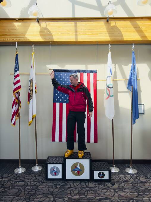 The author Scott Hannaford stops for a cheesy selfie on the original 1960 medal podium at the Olympic museum. Picture: Andrew Suggit
