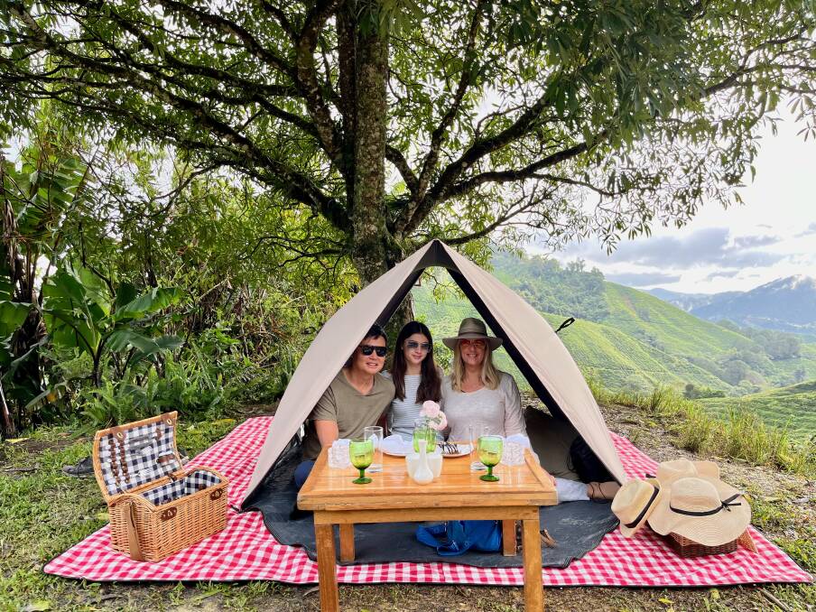 The writer and her family enjoy a picnic. The writer and her family enjoy a picnic.