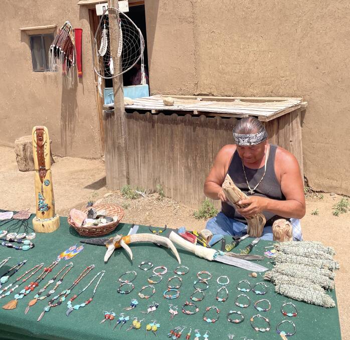 Craftsman at work in Taos Pueblo. Picture: Rob McFarland