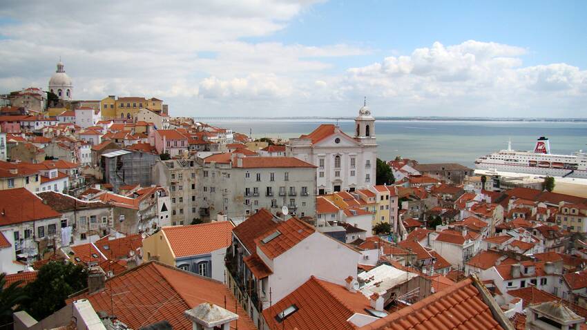 The terracotta-tiled rooftops of the city.