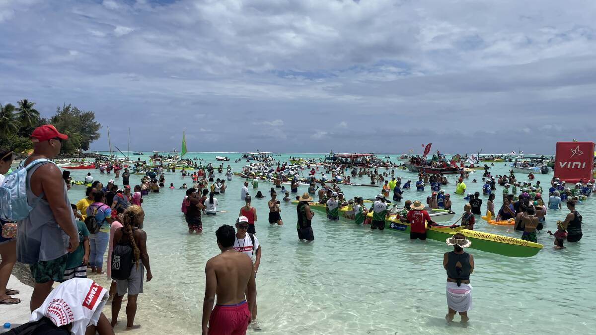 Crowds gather on the beach to watch the end of the Hawaiki Nui Va'a in Bora Bora. Picture: Sarah Falson