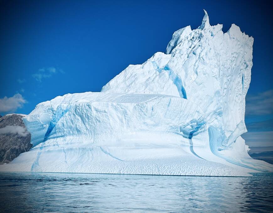 Up close and personal with a towering iceberg. Picture: Garry Linnell