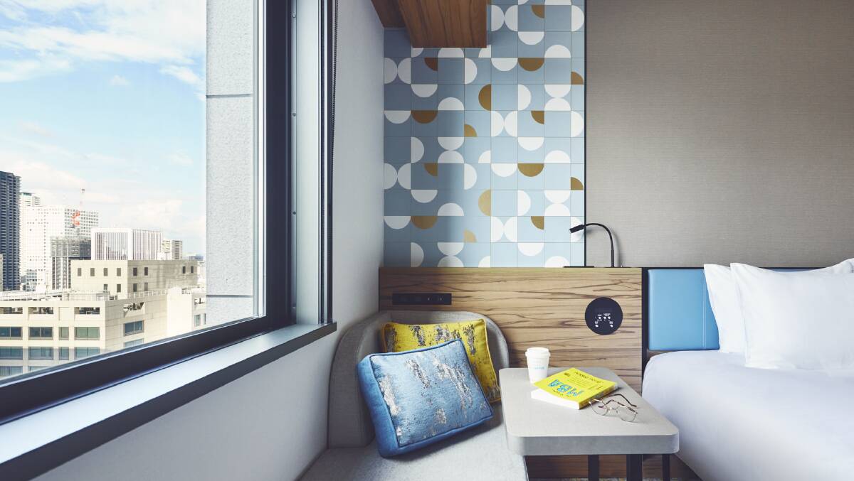 A guestroom with city views. A guestroom with city views.