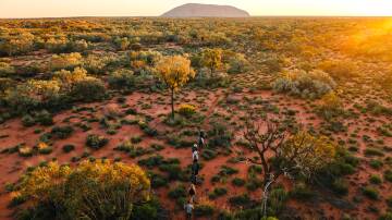 Walkers on the the Uluru-Kata Tjuta Signature Walk. Picture by Michael Peters