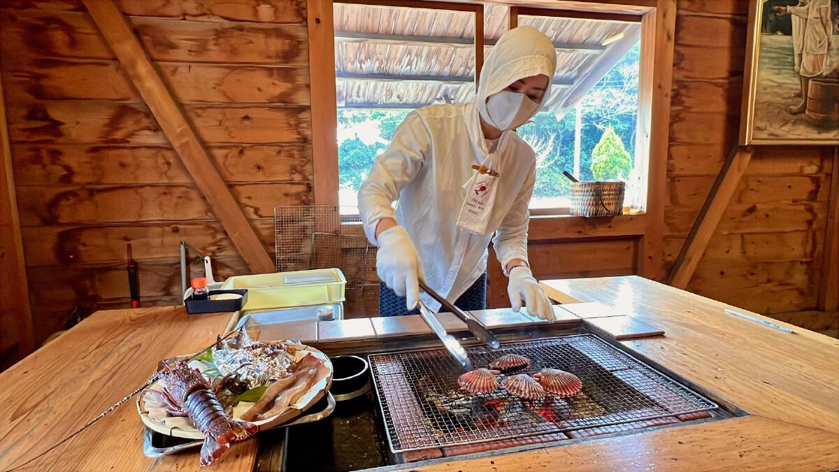 An Ama diver at the grill. Picture by Kristie Kellahan An Ama diver at the grill. Picture by Kristie Kellahan