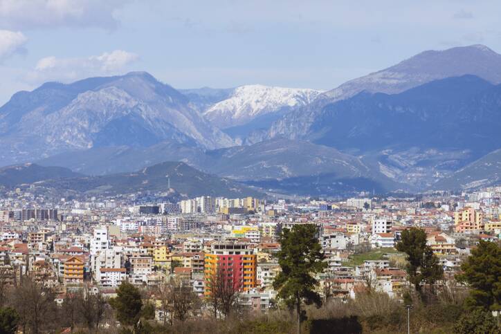 Tirana's mountainous backdrop.