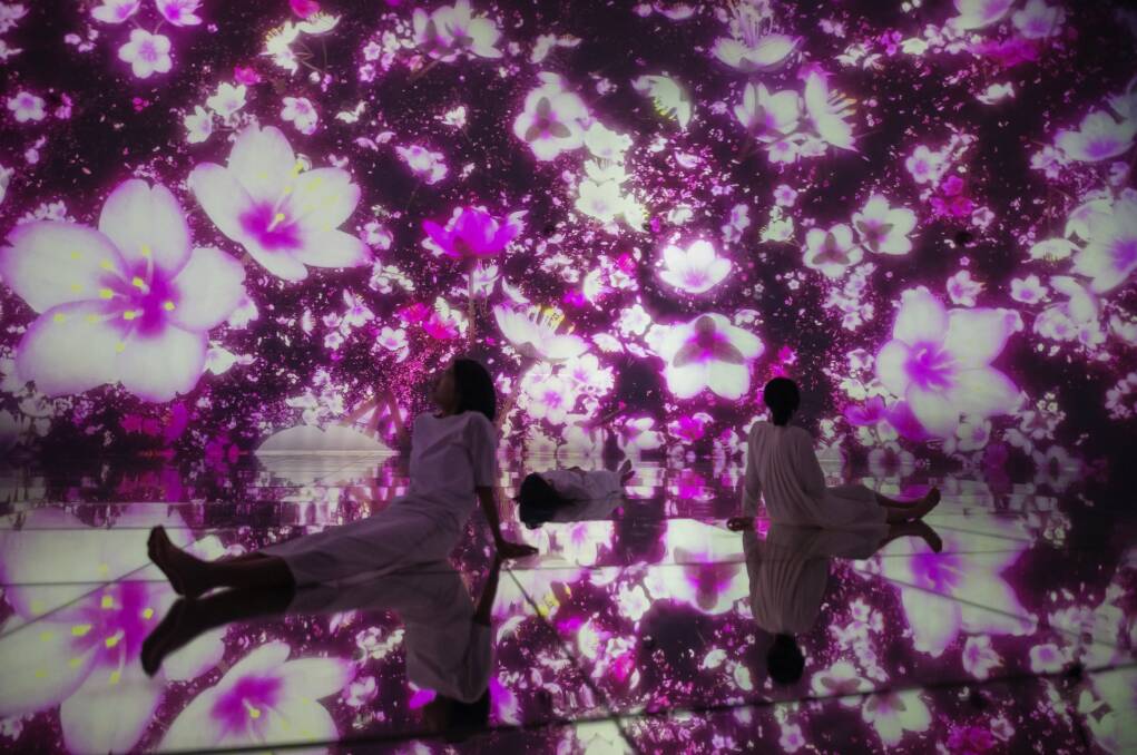 Floating in the Falling Universe of Flowers at Tokyo's teamLab Planets. Floating in the Falling Universe of Flowers at Tokyo's teamLab Planets.