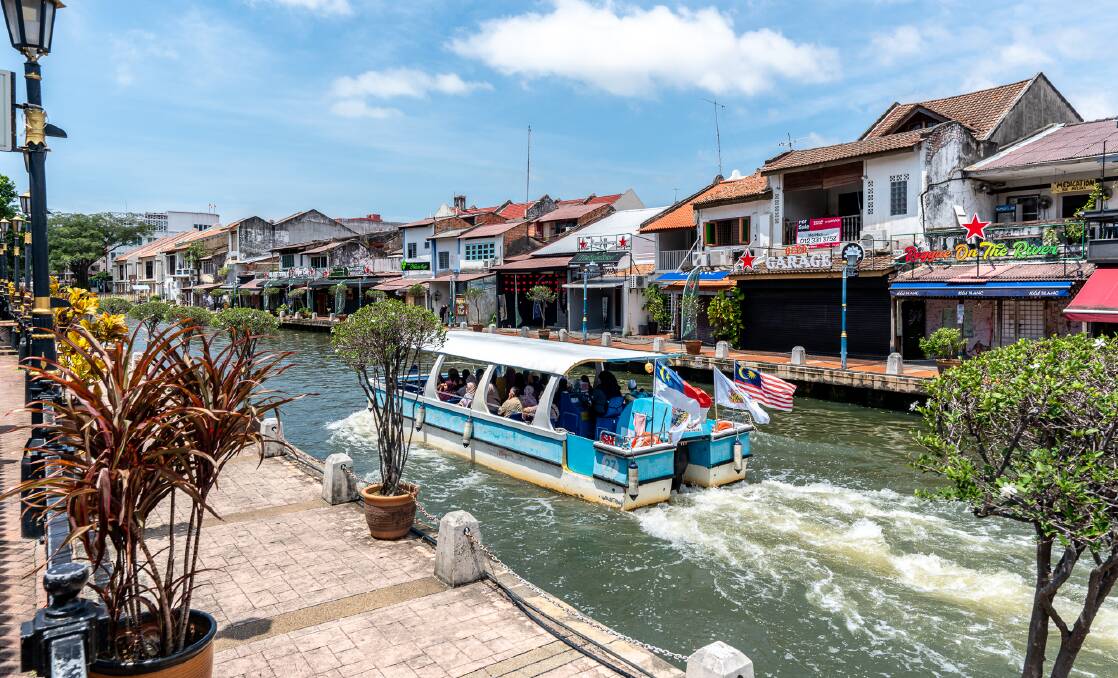 A sightseeing boat on the Melaka River. A sightseeing boat on the Melaka River.