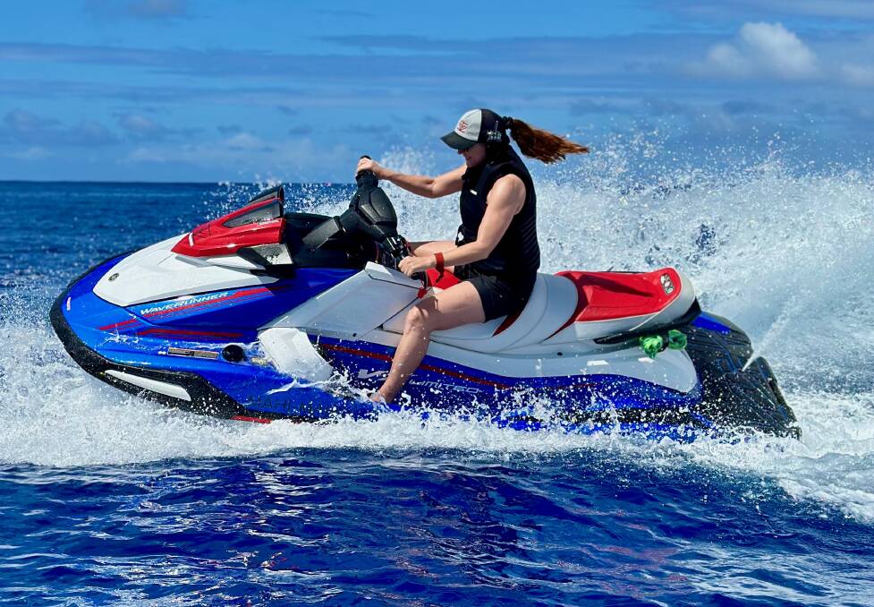 Cruise explorer on a jet ski in the Cook Islands.