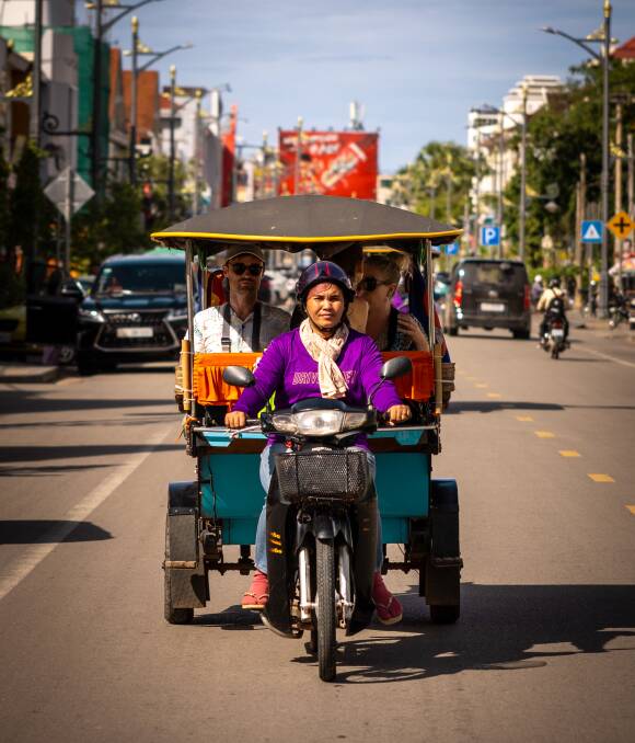 The writer (at left) takes a Tuk Tuk drive. Picture: Intrepid The writer (at left) takes a Tuk Tuk drive. Picture: Intrepid