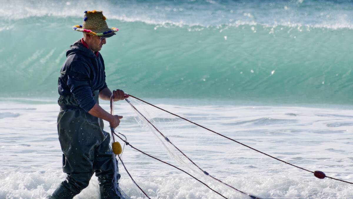 A Moroccan net fisherman. A Moroccan net fisherman.