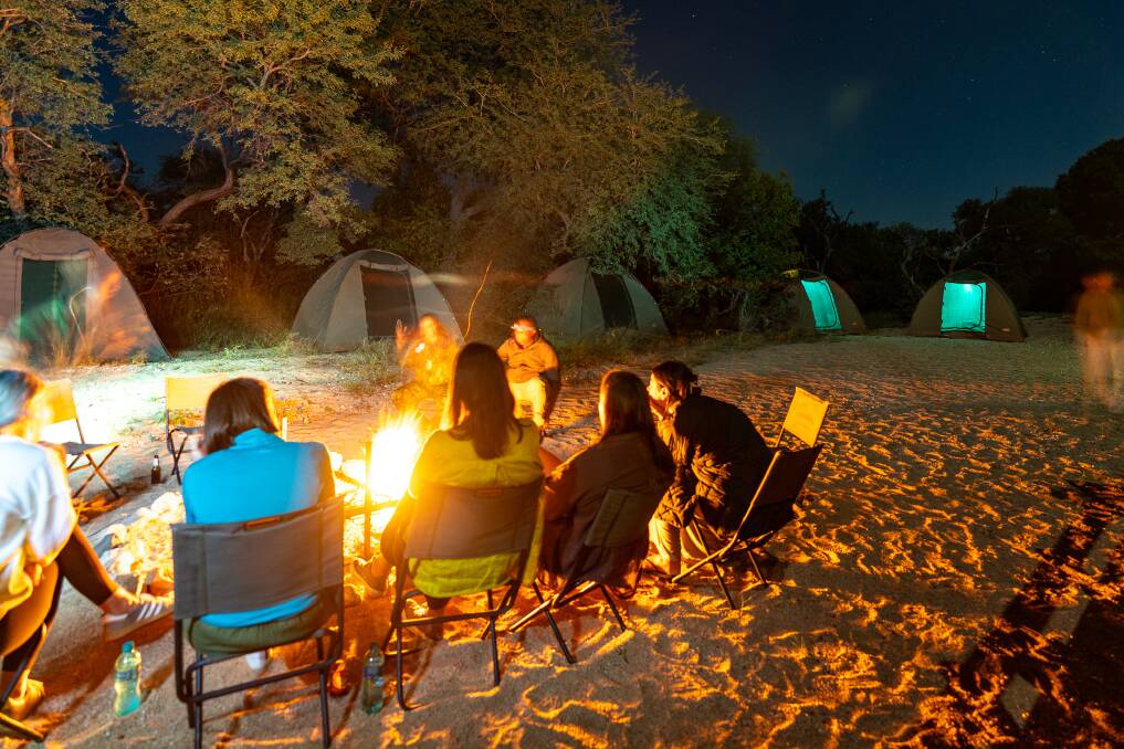 A fireside conversation at the campsite. Picture by Michael Turtle