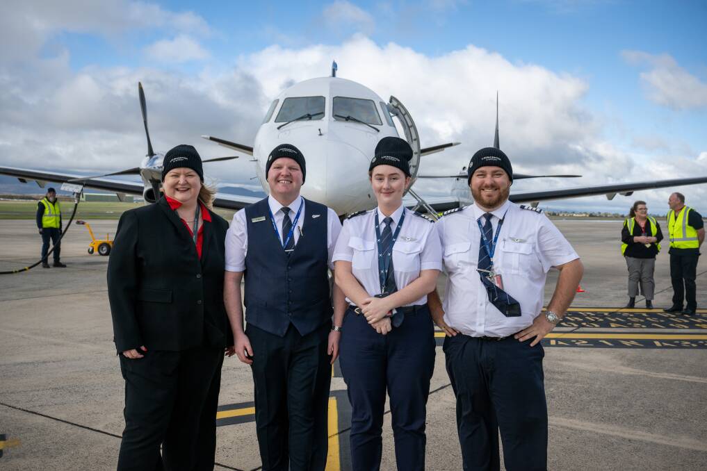 Launceston Airport chief executive Katie Cooper, cabin manager Logan Smith, First Officer Anneka Williams and Captain Matthew Goodall after the first Canberra to Launceston flight by Link Airways. Picture by Paul Scambler