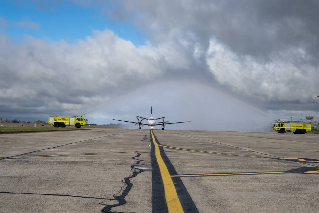 Link Airways flight FC275 receives a water cannon salute as it arrives at Launceston Airport. Picture by Paul Scambler