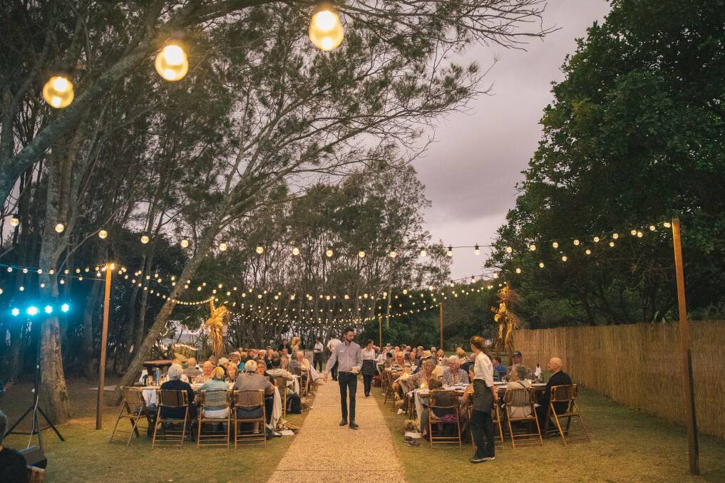 A Great Southern off-train dinner experience under festoon lights at Pacific Bay Resort in Coffs Harbour, New South Wales.