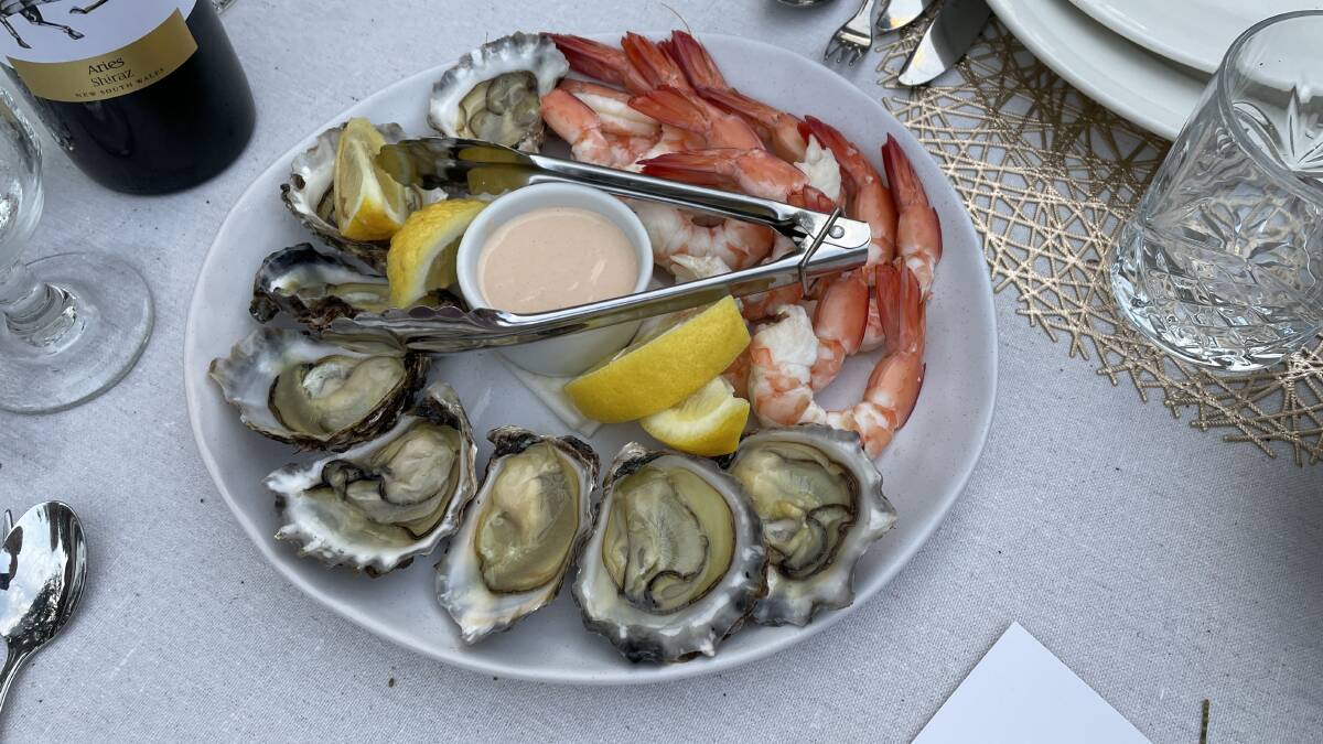 Oysters and prawns served at dinner at Pacific Bay Resort, Coffs Harbour. Picture: Anthony Caggiano