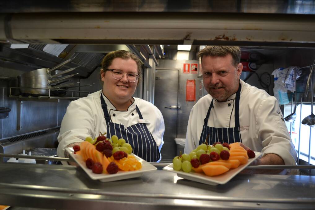 Chef de partie Kyal van Gastel and chef Tim Noble in the kitchen railcar aboard the Great Southern. Picture: Anthony Caggiano