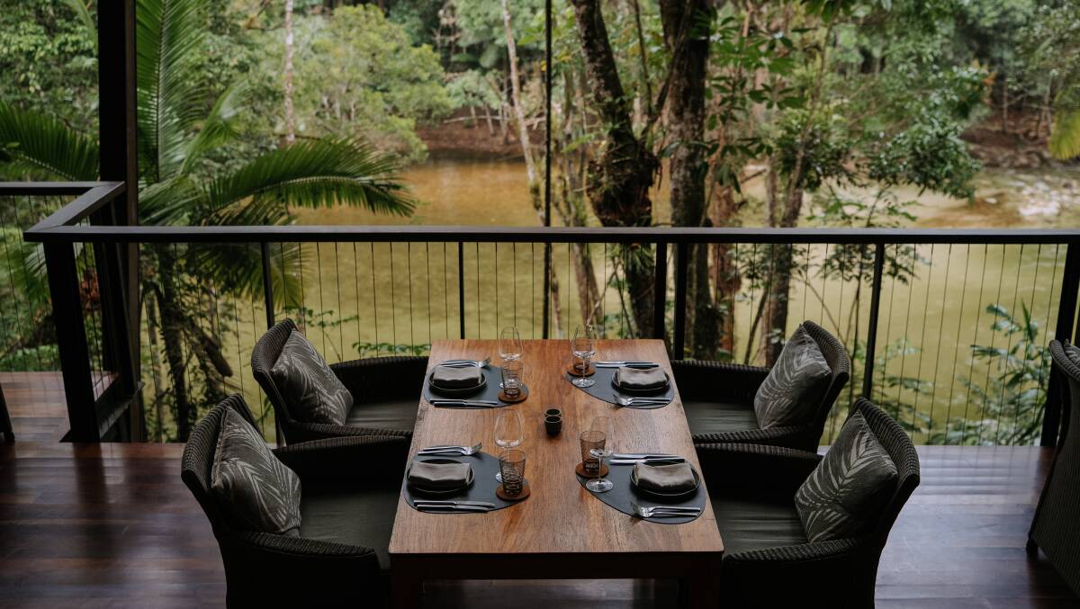 Gorge-side dining at the Treehouse at Silky Oaks Lodge.