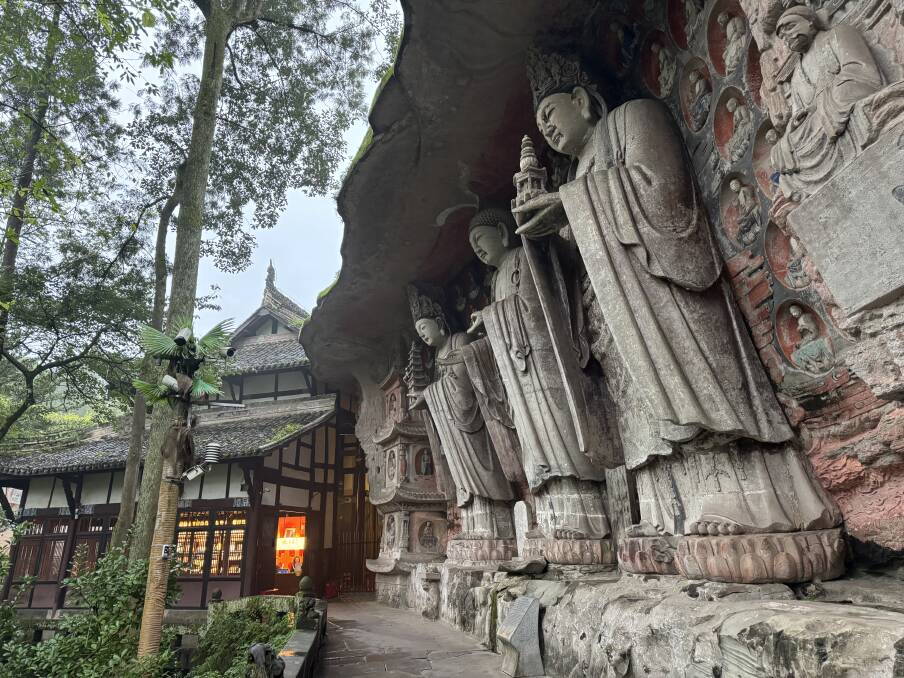 Three carved Buddhas standing more than seven metres tall in the Dazu Caves complex. Picture by Bageshri Savyasachi
