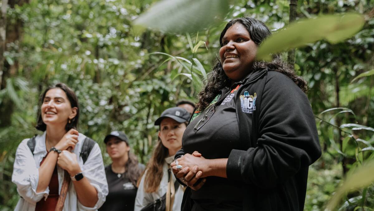 Guide at Mossman Gorge Cultural Centre, Emily Kulka (right), seen taking a group through a tour of ancient native flora.