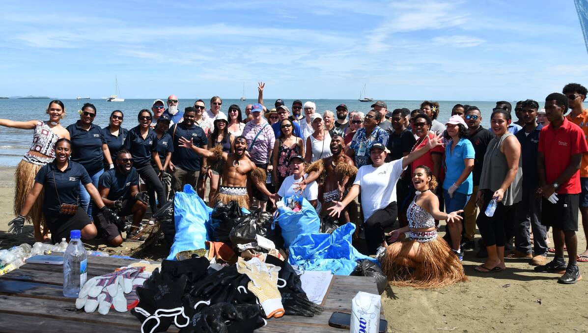From top: Wailoaloa Beach in Fiji; the clean-up team; NCL's Rade Vuk Malobabic at work. Pictures: Getty Images; supplied From top: Wailoaloa Beach in Fiji; the clean-up team; NCL's Rade Vuk Malobabic at work. Pictures: Getty Images; supplied