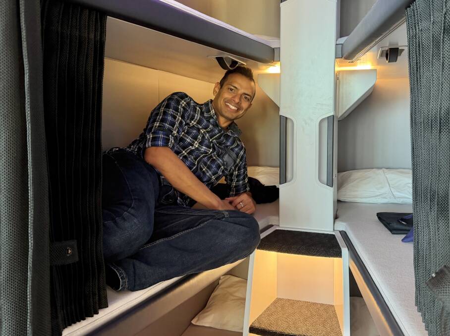 The writer trying out Air New Zealand's new economy bunk beds.