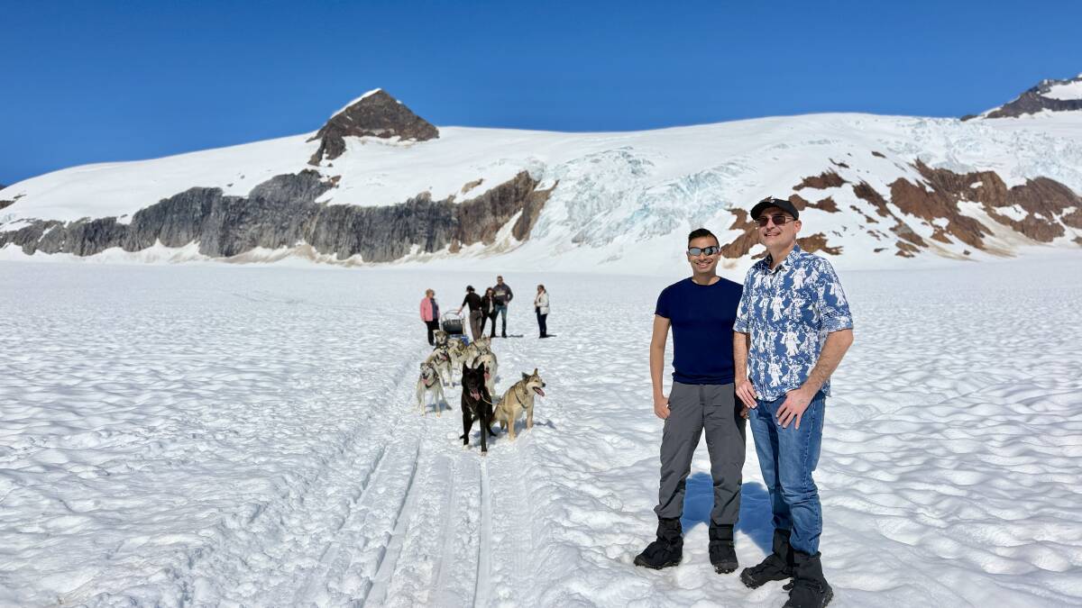 The writer (second from right) before the dog-sledding experience with Alaskan huskies. The writer (second from right) before the dog-sledding experience with Alaskan huskies.