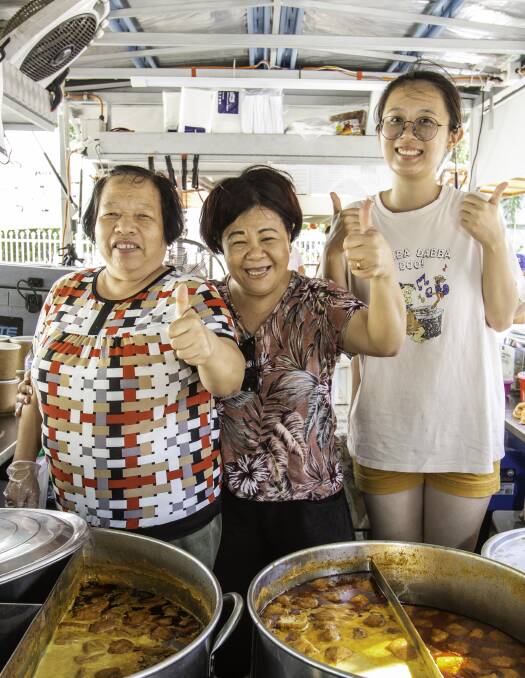 Thumbs up at the laksa festival. Thumbs up at the laksa festival.