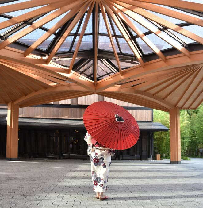 The Japanese-umbrella-inspired ceiling above the driveway.