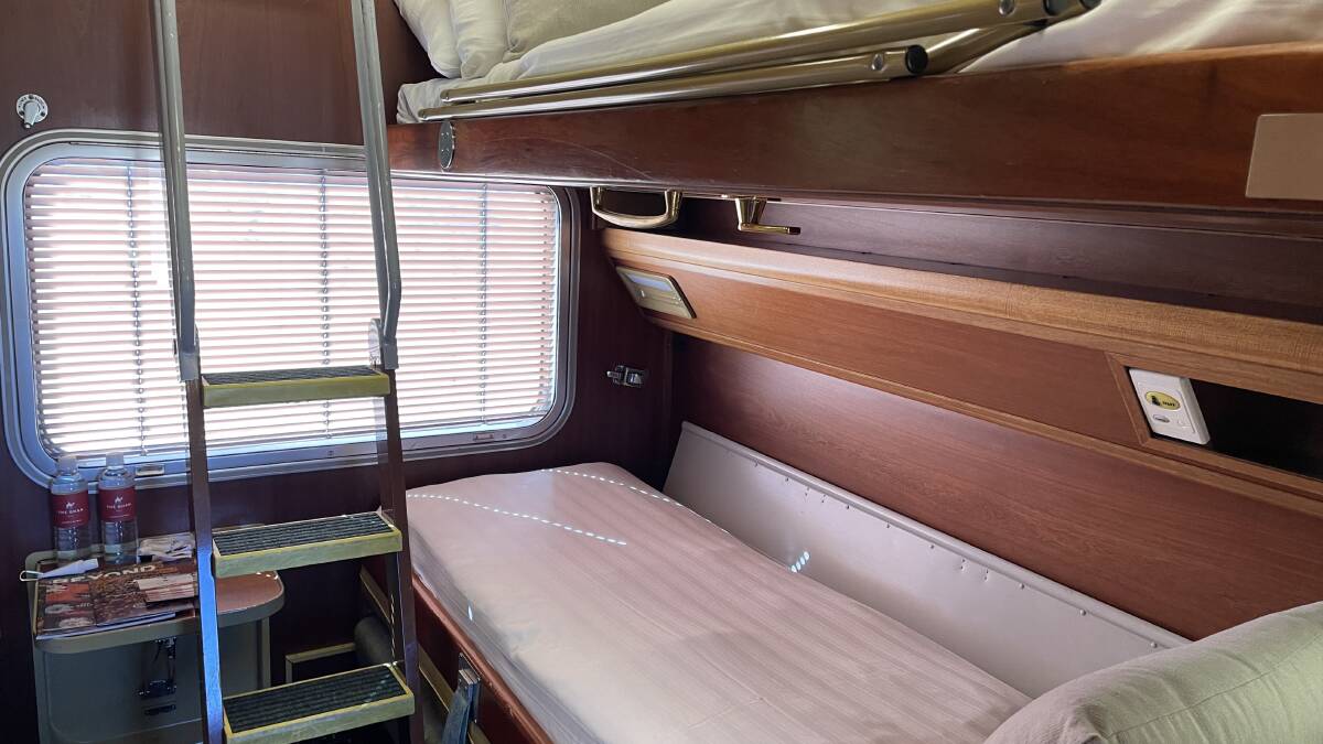 Night setup of a gold twin cabin on The Ghan. Picture: Katie Spurgo