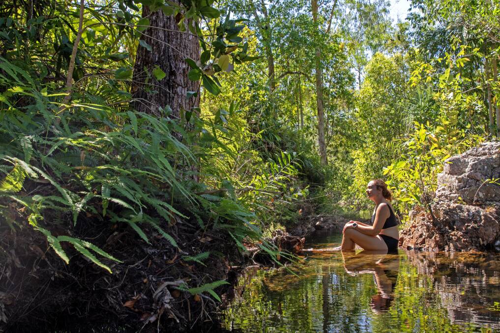 Woman at Walker Creek, Litchfield National Park.