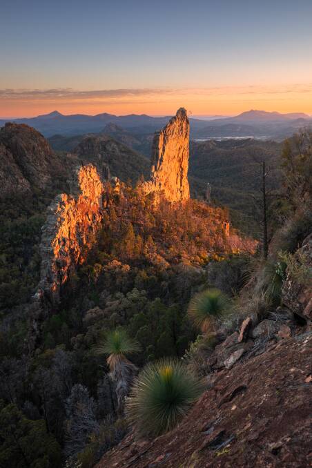 Sun rising over the Breadknife rock formation in Warrumbungle National Park. Picture: Destination NSW Sun rising over the Breadknife rock formation in Warrumbungle National Park. Picture: Destination NSW