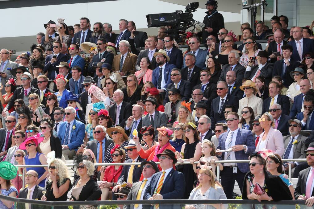 Riveted crowds at the Melbourne Cup. Picture: Shutterstock Riveted crowds at the Melbourne Cup. Picture: Shutterstock