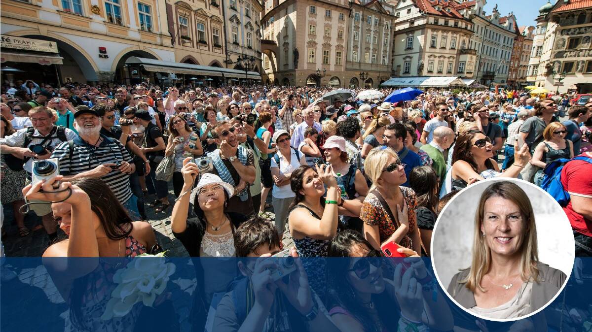 A horde shuffles, zombie-like, towards its monumental prey ... in this case, Prague's famous astronomical clock. Picture by Getty Images