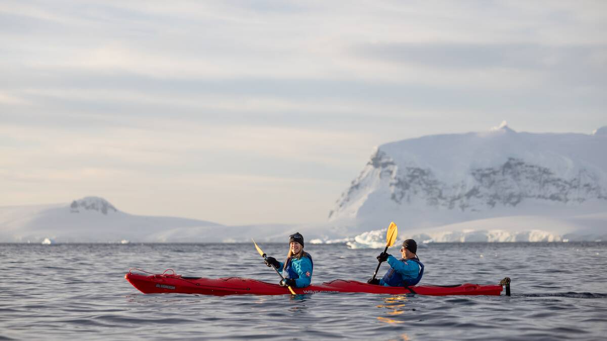 Travellers paddle on Antarctica's Orne Harbour as part of an HX Expeditions itinerary. Travellers paddle on Antarctica's Orne Harbour as part of an HX Expeditions itinerary.