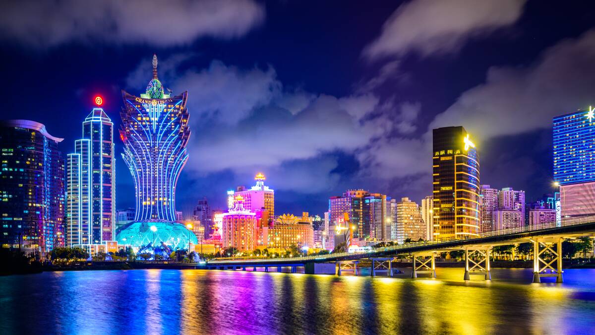 The glittering skyline and harbour in Macau. Picture: Getty Images The glittering skyline and harbour in Macau. Picture: Getty Images