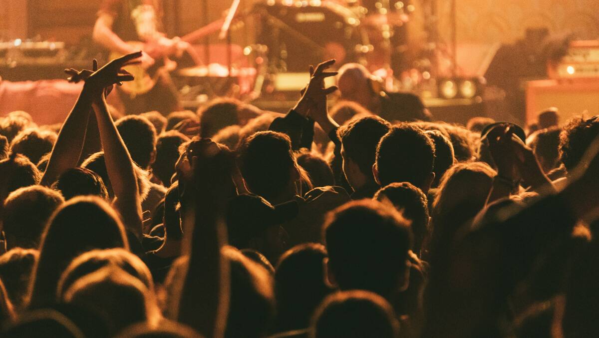 Revellers at a Melbourne gig bar. Picture Unsplash/Jay Wennington