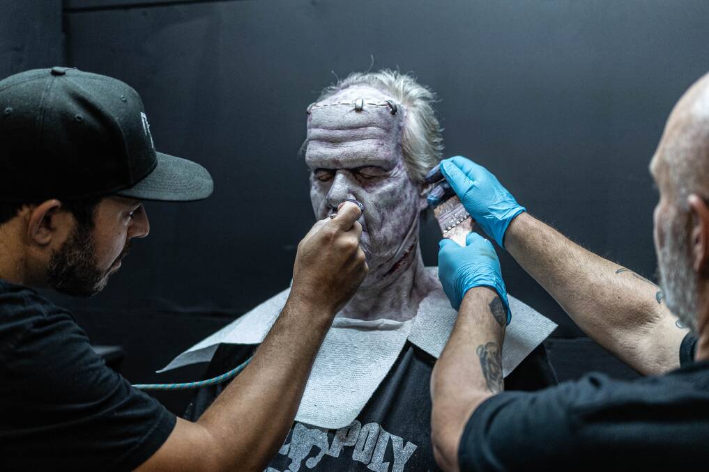 Demonic bit-player gets into character, with the help of skilled make-up artists. Demonic bit-player gets into character, with the help of skilled make-up artists.