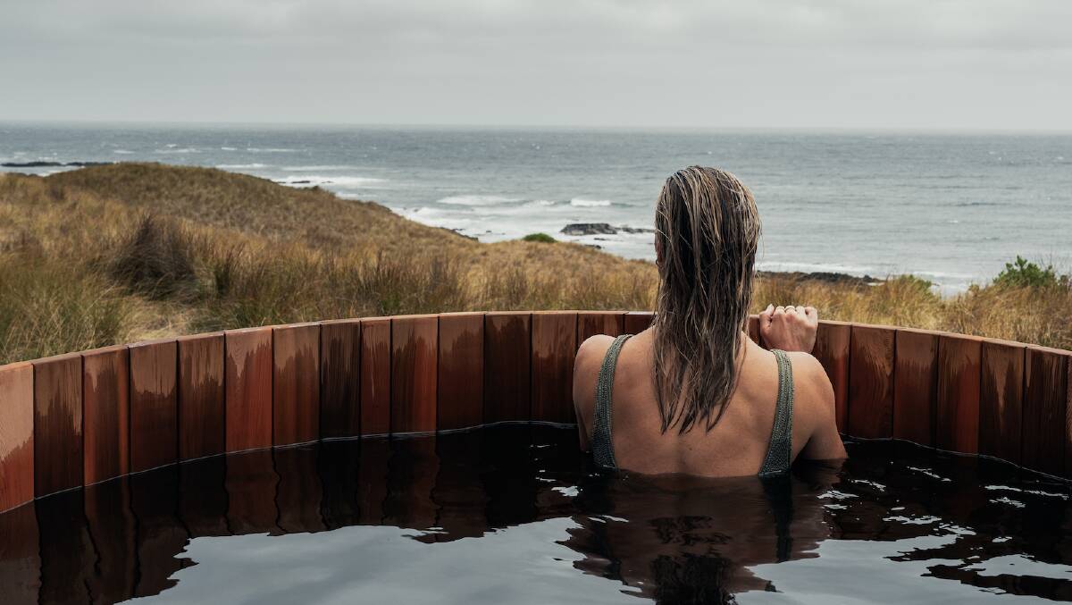A visitor in the outdoor hot tub at Kittawa Lodge on King Island. Picture supplied A visitor in the outdoor hot tub at Kittawa Lodge on King Island. Picture supplied